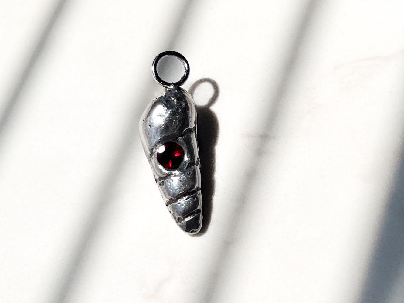 Dainty silver Shell charm with garnet gemstone