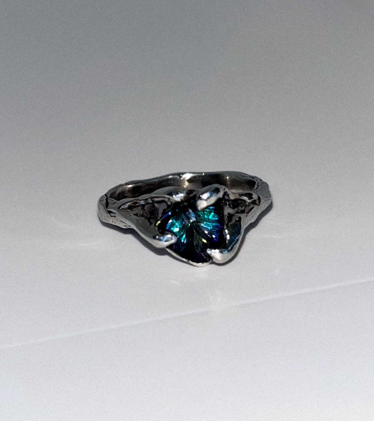 Multi colored silver ring, blue gemstone