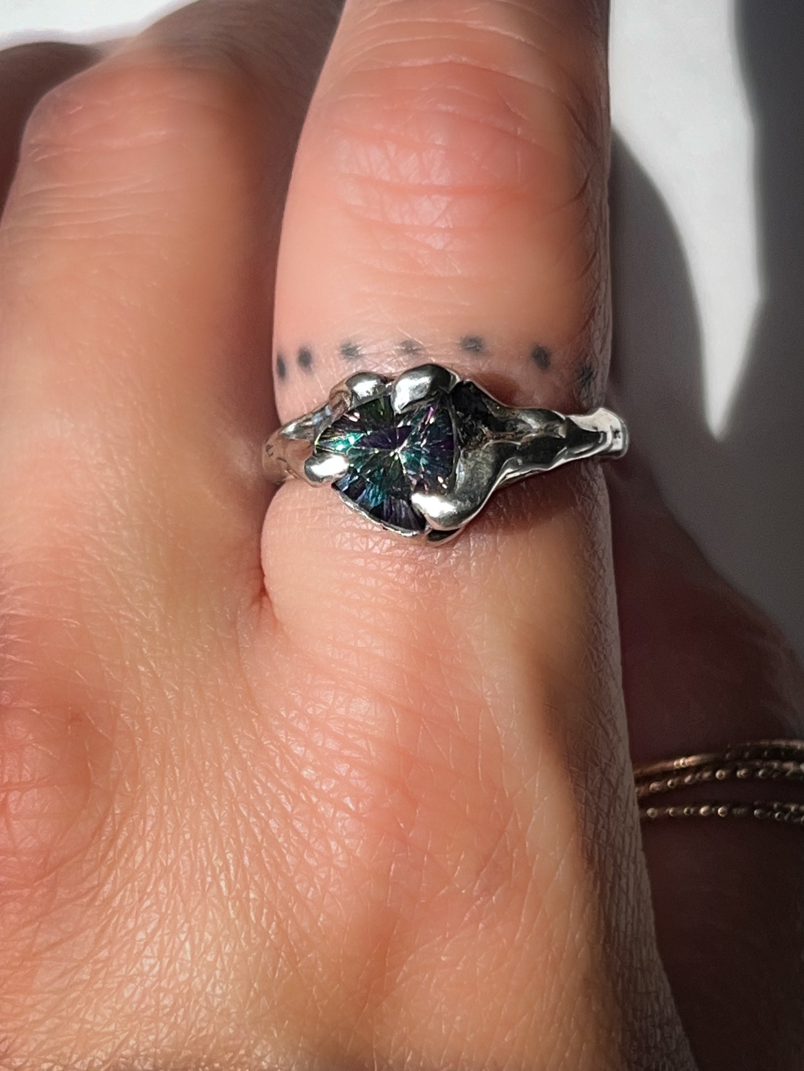 Ring on finger, Mystic Topaz